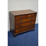 A GEORGIAN OAK AND MAHOGANY CROSSBANDED CHEST OF TWO SHORT OVER THREE LONG DRAWERS, with brass