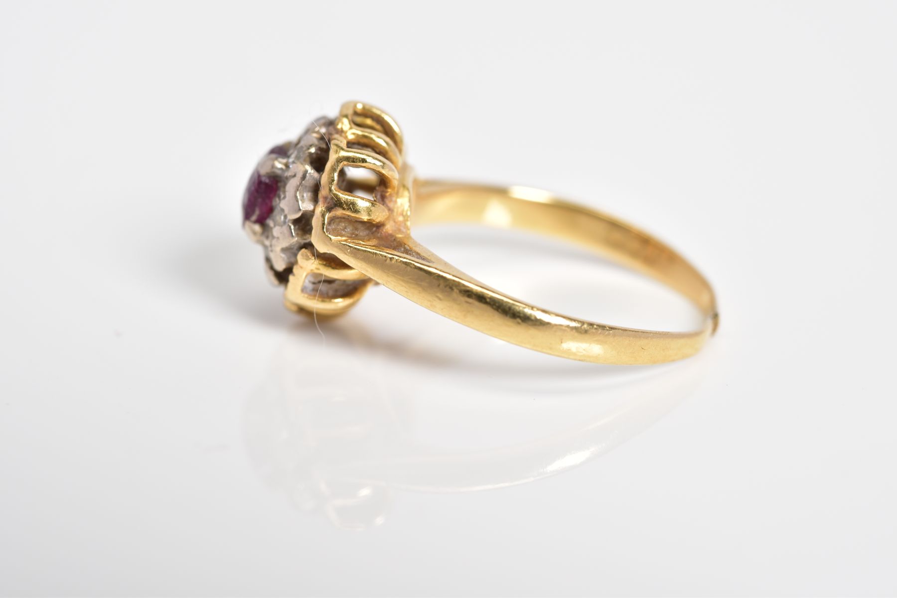 A RUBY AND DIAMOND CLUSTER RING, designed with a central circular cut ruby with single cut diamond - Image 2 of 3