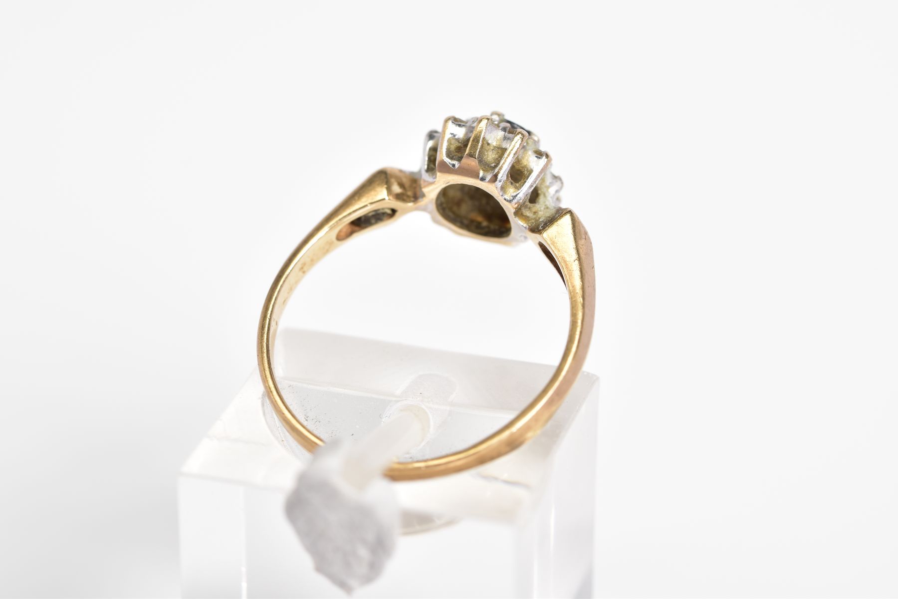 A 9CT GOLD SAPPHIRE AND DIAMOND CLUSTER RING, set with a central oval cut sapphire within a single - Image 3 of 3