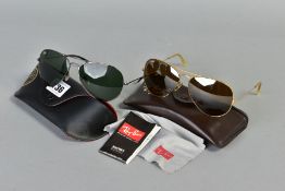 TWO PAIRS OF RAY-BAN SUNGLASSES, both of aviator design, the first with a black frame and dark