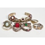 A SELECTION OF JEWELLERY, to include eleven rings such as two silver opal and garnet cluster ring,