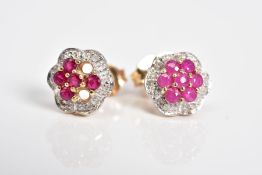 A NEAR PAIR OF MATCHING 9CT GOLD RUBY AND DIAMOND CLUSTER EARRINGS, each cluster set with circular