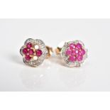 A NEAR PAIR OF MATCHING 9CT GOLD RUBY AND DIAMOND CLUSTER EARRINGS, each cluster set with circular