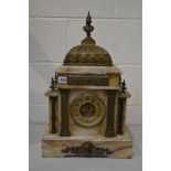 AN EARLY 20TH CENTURY MARBLE AND BRASS FRENCH MANTEL CLOCK, with a Roman figure finial, the brass