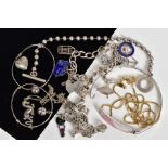 A SELECTION OF JEWELLERY, to include a silver charm bracelet with seven charms such as a crown,