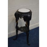 A MID 20TH CENTURY EBONISED CARVED HARDWOOD ORIENTAL JARDINERE STAND with three Elephant head and