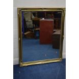 A MODERN FOLIATE GILT WOOD BEVELLED EDGE WALL MIRROR, 105cm x 129cm