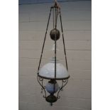 AN EARLY 20TH CENTURY BRASS RISE AND FALL CEILING OIL LAMP, with glass shades and funnel, diameter