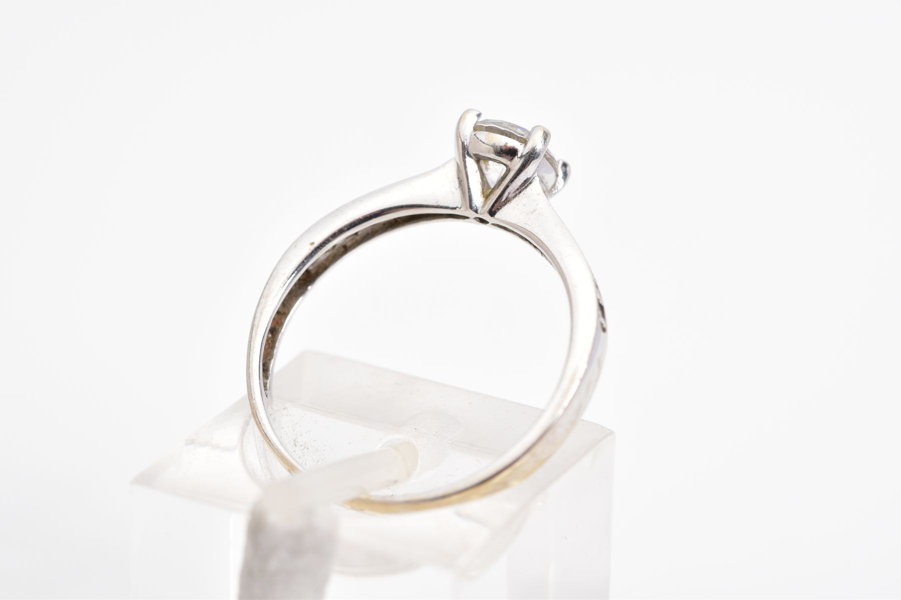 A SINGLE STONE RING, the white metal ring set with a central circular cut stone assessed as paste, - Image 3 of 3