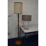 AN ART DECO BRASSED AND WALNUT STANDARD LAMP with a fabric shade together with a decorative
