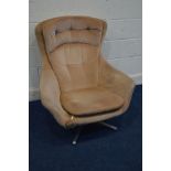 A DISTRESSED MID 20TH CENTURY ARNE JACOBSEN STYLE SWIVEL CHAIR, (one arm broken, this chair does not