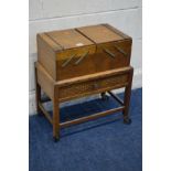 AN EARLY TO MID 20TH CENTURY OAK CANTILEVER SEWING BOX, with a single drawer on casters, width