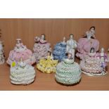 A COLLECTION OF NINE IRISH DRESDEN AND CONTINENTAL PORCELAIN LACE ENCRUSTED FIGURES, including a