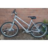 A SILVER LADIES RALEIGH TUNDRA BICYCLE with grip shift max handles and gears