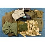 A MILITARY STYLE KITBAG, containing a number of British Army Trousers, WWII/post WWII together