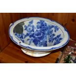 A VICTORIAN BLUE AND WHITE TOILET BOWL with Hollyhock design to the inside surface