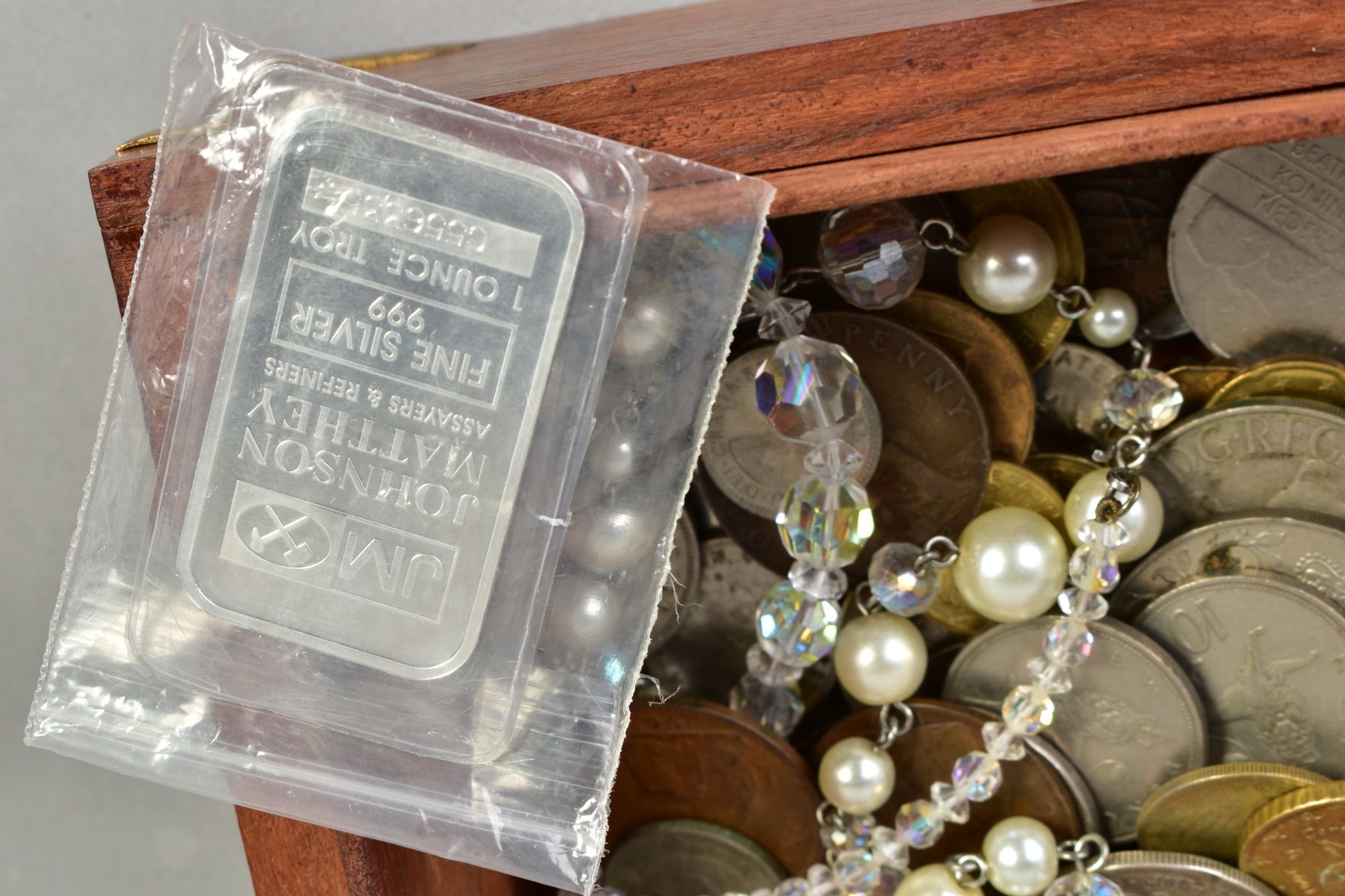 A WOODEN BOX OF MIXED COINAGE, to include a one ounce silver bar, a part silver buckle, a 1887 - Image 2 of 2