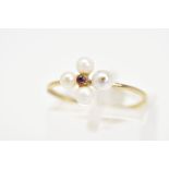 A 9CT GOLD RUBY AND PEARL RING, designed with a central circular cut ruby and cultured seed pearl