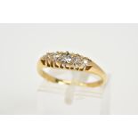 AN EARLY 20TH CENTURY FIVE STONE DIAMOND RING, designed with five claw set graduated old cut