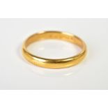 A 22CT GOLD WEDDING BAND, the plain polished band with a 22ct hallmark for Birmingham, ring size