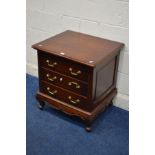 A SMALL REPRODUCTION MAHOGANY CHEST OF THREE DRAWERS on cabriole legs, width 65cm x depth 55cm x