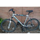 A SILVER GENTLEMANS CLAUD BUTLER TRAIL RIDGE BICYCLE with shimano gears