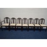 A SET OF SEVEN 19TH CENTURY HEPPLEWHITE CHAIRS with floral decoration to the top rail and drop in