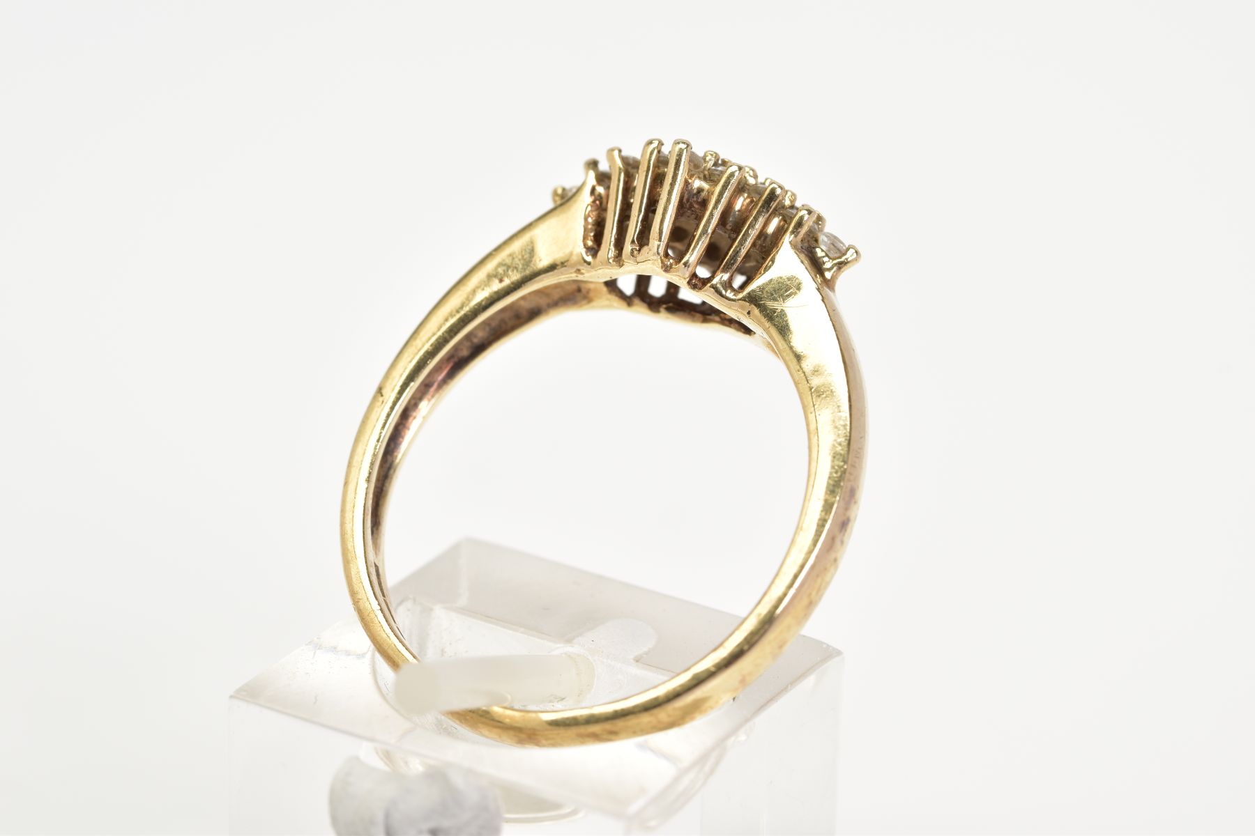 A 9CT GOLD CUBIC ZIRCONIA RING, set with a lozenge of claw set cubic zirconia, to a plain polished - Image 3 of 3