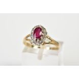 A 9CT GOLD RUBY AND DIAMOND CLUSTER RING, the tiered cluster set with a central cut ruby and