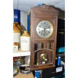 A 1920'S OAK DROP CASE WALL CLOCK, Arabic numerals, eight day movement, with pendulum and key,