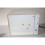 A BOSCH SKT5002GB TABLE TOP DISHWASHER 56cm wide, 45cm high (burn to front door, hole in waste