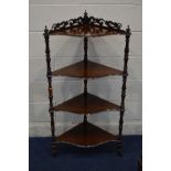 A VICTORIAN ROSEWOOD FOUR TIER SERPENTINE WHATNOT, the top tier with a foliate scrolled gallery