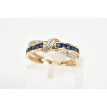 A 9CT GOLD SAPPHIRE AND DIAMOND RING, of crossover design set with a row of square cut sapphires and