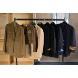 SEVEN ITEMS OF MILITARY CLOTHING, four navy blue Naval style jackets some with insignia, three