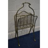 AN EARLY 20TH CENTURY BRASS MAGAZINE RACK of a tubular design with mesh sides, width 38cm x depth