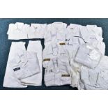 A BOX CONTAINING LARGE NUMBER OF NAVAL SHIRTS, skirts, trousers, all in white mostly British but