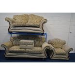 A CREAM AND FLORAL UPHOLSTERED FOUR PIECE LOUNGE SUITE, comprising a three and a two seater