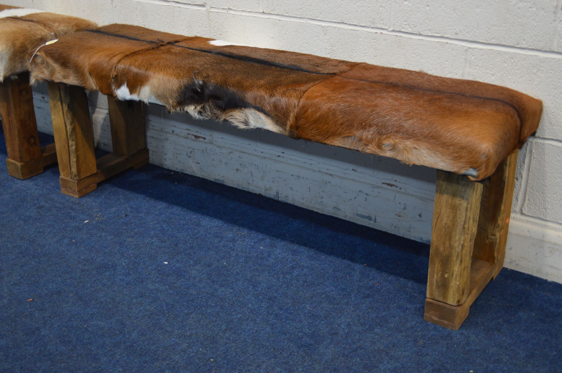 A PAIR OF RUSTIC RECTANGULAR STOOLS with animal hide seat covers, width 152cm x depth 44cm x - Image 3 of 3
