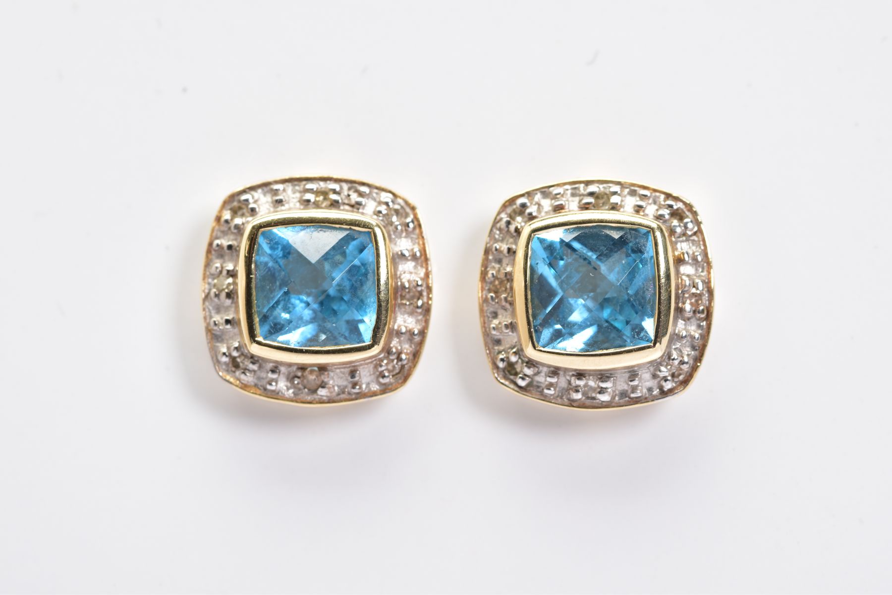 A PAIR OF TOPAZ AND DIAMOND SET EARRINGS, each yellow metal earring designed with a faceted square