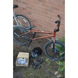 A BROWN KHEBIKES ACME BMX with helmet and spare accessories