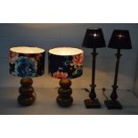 A PAIR OF MODERN BROWN CERAMIC TRIPLE BOBBIN TABLE LAMPS with floral shades, together with another