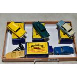 FOUR BOXED MATCHBOX 1-75 SERIES DIECAST VEHICLES, Ford Station Wagon, No 31 yellow body, metal