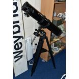 A SIMMONS ASTRONOMICAL TELESCOPE MODEL 6450, focal length 900mm, diameter 4.5 inches, together