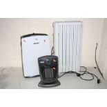 A DIMPLEX DXDH10N DEHUMIDIFIER together with a delonghi dragon portable radiator and delonghi
