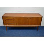 A MID 20TH CENTURY YOUNGER TEAK SIDEBOARD, with double cupboard doors flanked by four drawers, on