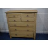 A MODERN OAK CHEST OF FOUR SHORT OVER THREE LONG DRAWERS, width 127cm x depth 55cm x height 123cm