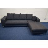 A DWELL CHARCOAL UPHOLSTERED CORNER SOFA on a chrome frame, width 271cm x depth 183cm (one hole to