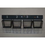 A SET OF FOUR METAL WALL MOUNTED HANGING BASKETS, width 115cm