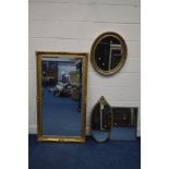 A MODERN FOLIATE GILT WOOD FRAMED BEVELLED EDGE WALL MIRROR, 135cm x 74cm, together with an oval