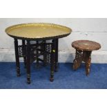 A CIRCULAR BRASS TOPPED FOLDING OCCASIONAL TABLE, together with a hardwood occasional table (2)